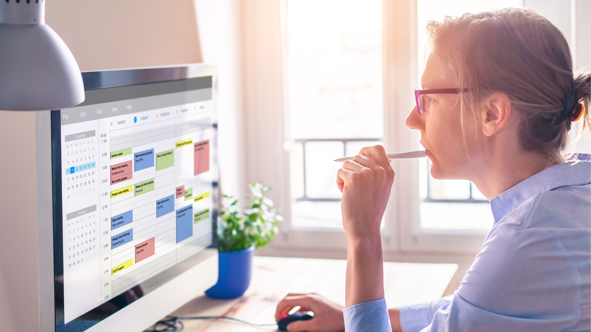woman in front of a computer showing time management skills