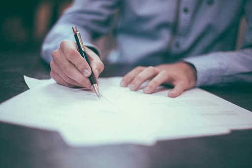 an image of a person signing documents